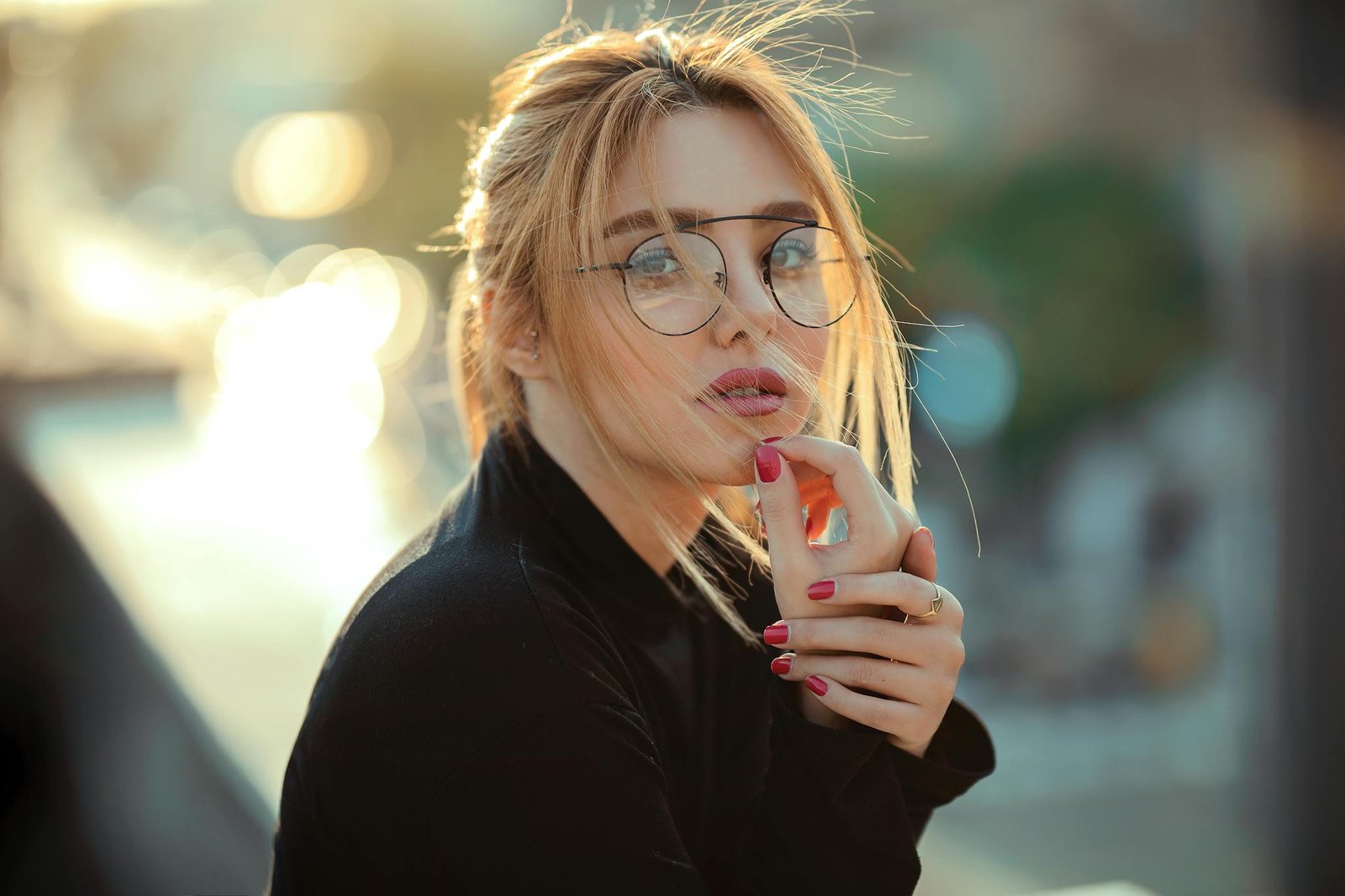 Woman Wears Eyeglasses and Touching Her Chin