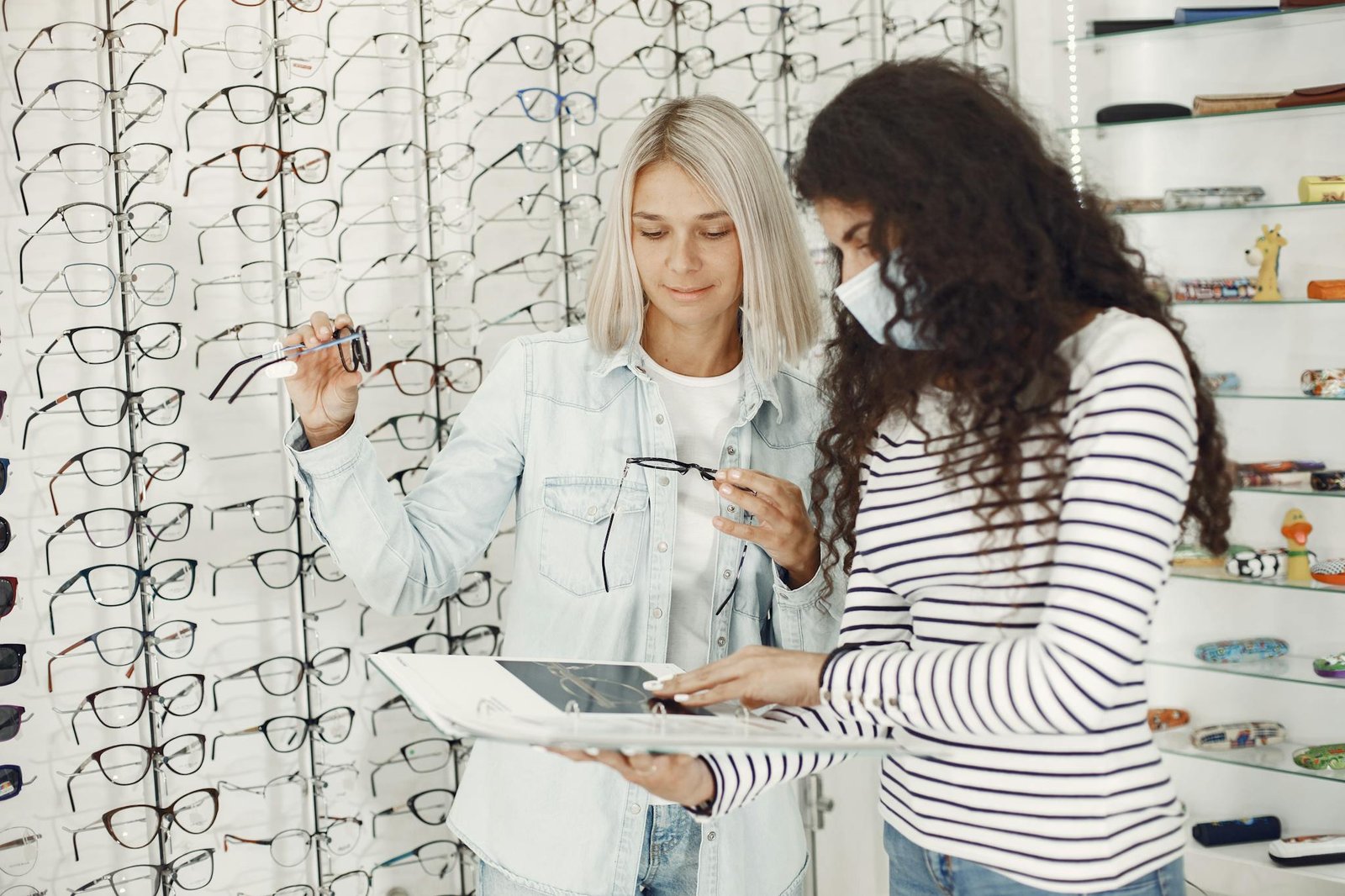 Women Choosing Glasses in an Optical Salon 